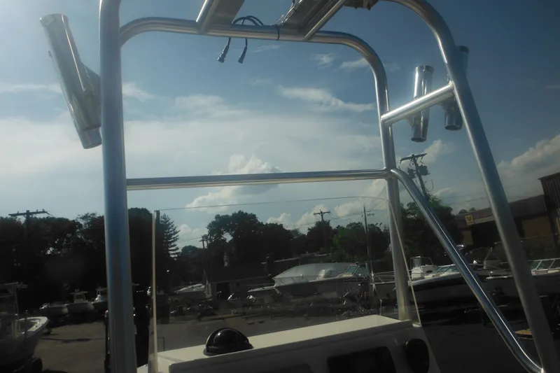 Slide: The Image of Parker 1801 Center Console boat, 2001 model, with T-top and clear sky background. - 26