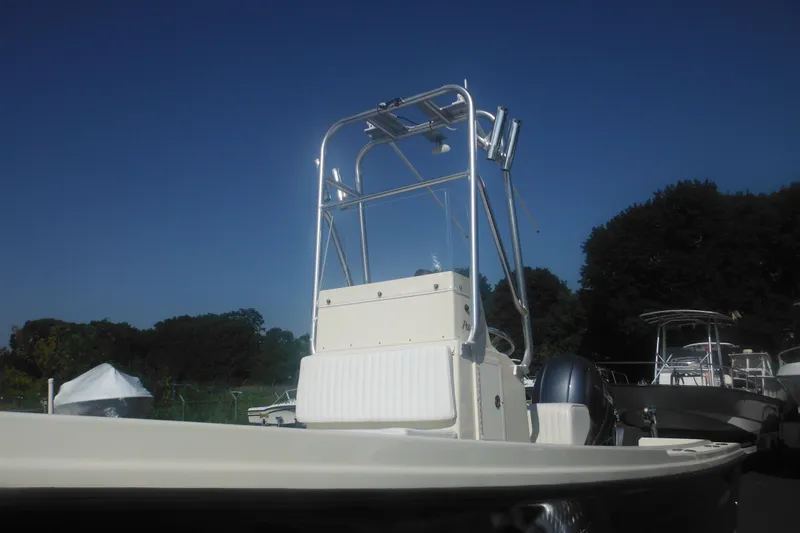 Slide: The Image of 2001 Parker 1801 Center Console boat with clear blue sky background. - 12