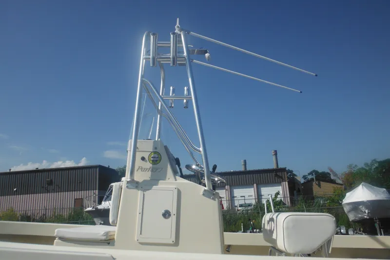 Slide: The Image of 2001 Parker 1801 Center Console boat with T-top against clear blue sky. - 9