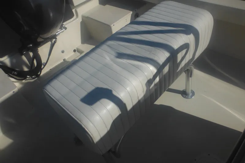 Slide: The Image of White cushioned seat on 2001 Parker 1801 Center Console boat. - 41