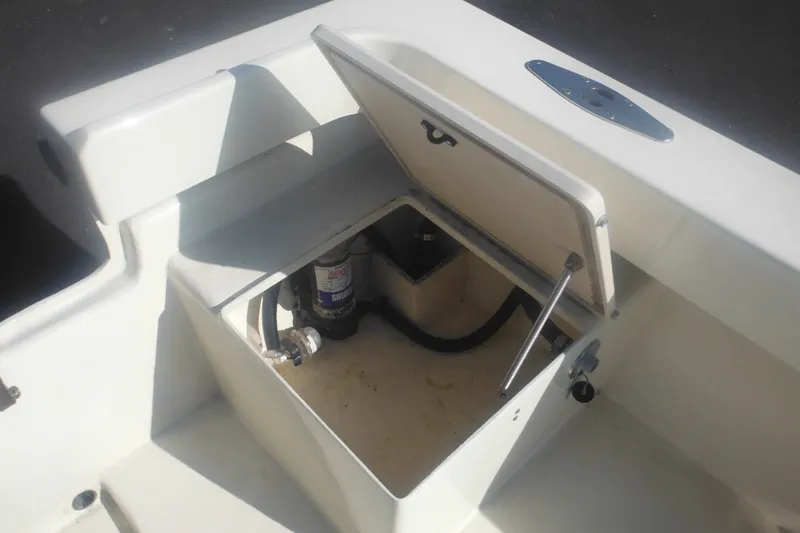 Slide: The Image of Open storage compartment on a 2001 Parker 1801 Center Console boat. - 36