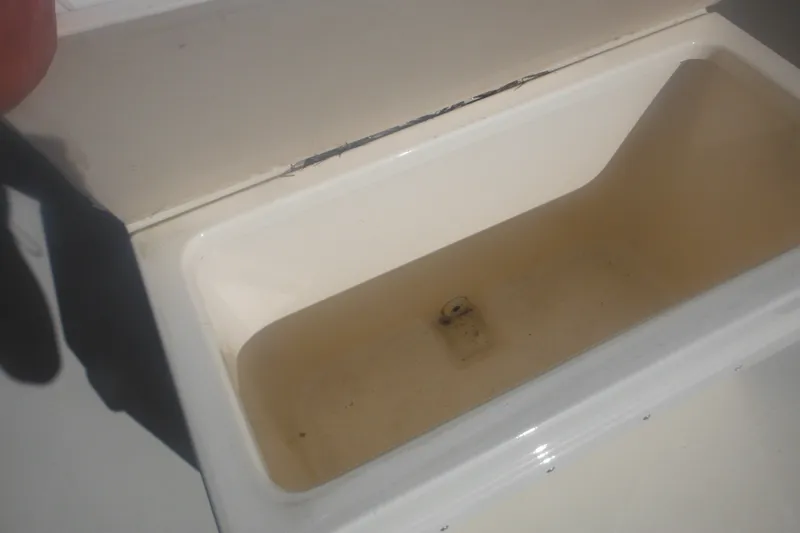 Slide: The Image of Open storage compartment on a 2001 Parker 1801 Center Console boat. - 18