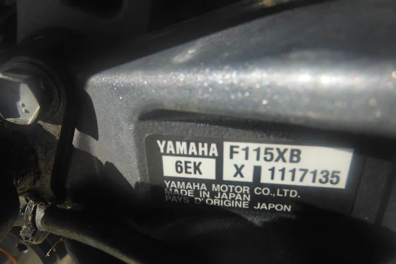 Slide: The Image of Close-up of Yamaha F115XB engine label on Parker 1801 Center Console, 2001 model. - 47