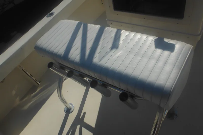 Slide: The Image of White cushioned seat on 2001 Parker 1801 Center Console boat, featuring rod holders. - 40