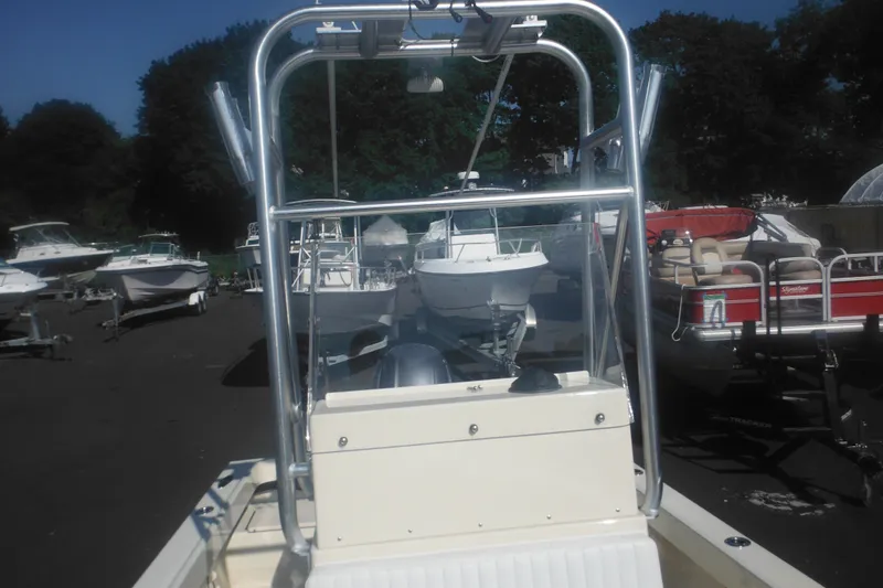Slide: The Image of 2001 Parker 1801 Center Console boat in a marina with other vessels. - 17