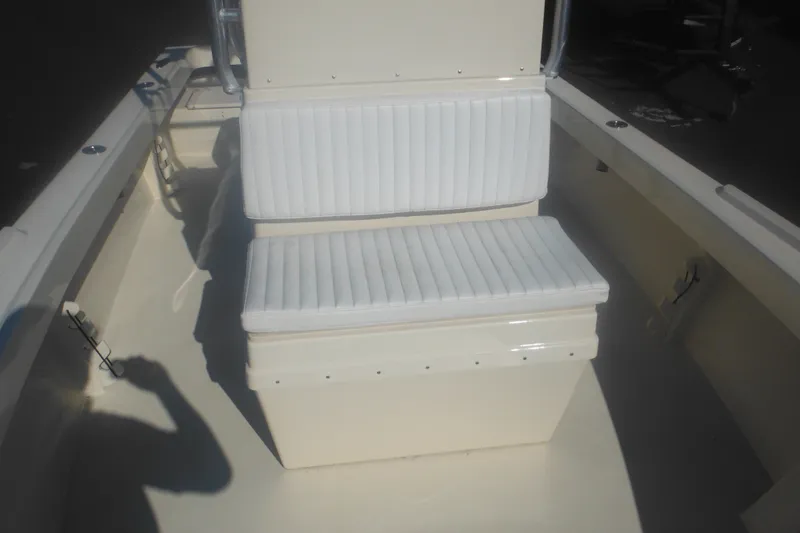 Slide: The Image of 2001 Parker 1801 Center Console boat interior with white cushioned seating. - 16