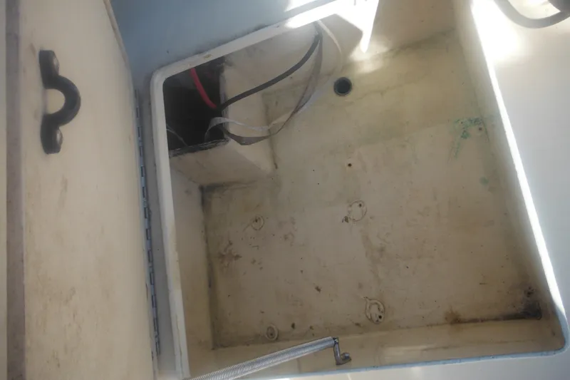 Slide: The Image of Open storage compartment of a 2001 Parker 1801 Center Console boat. - 38