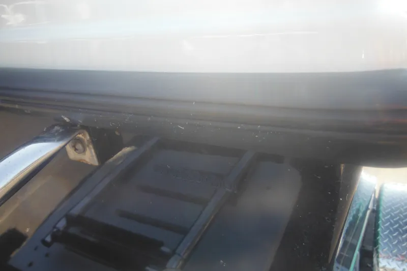 Slide: The Image of Close-up of a 2001 Parker 1801 Center Console boat detail, showing metal and plastic components. - 5