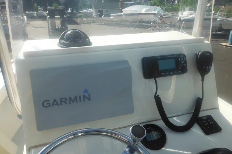 Slide: The Image of Center console of 2001 Parker 1801 boat with Garmin and Icom equipment. - 32