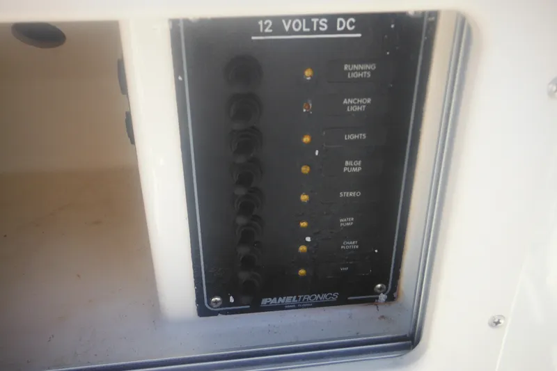 Slide: The Image of Control panel of a 2001 Parker 1801 Center Console boat, featuring various switches. - 30