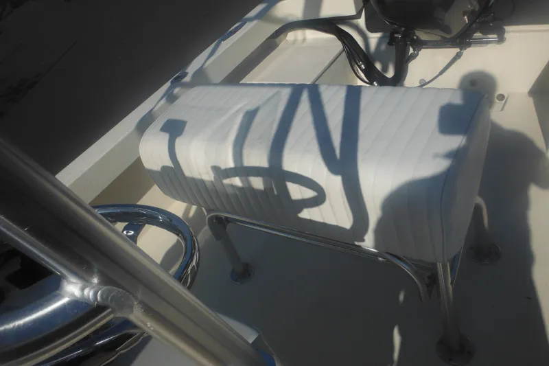 Slide: The Image of 2001 Parker 1801 Center Console boat seat with chrome details and shadow play. - 44