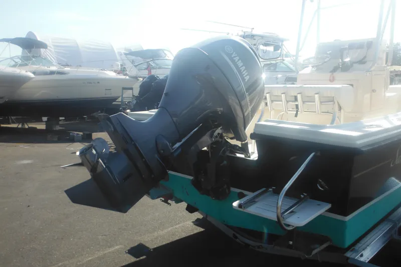 Slide: The Image of 2001 Parker 1801 Center Console boat with Yamaha outboard motor in a marina. - 4