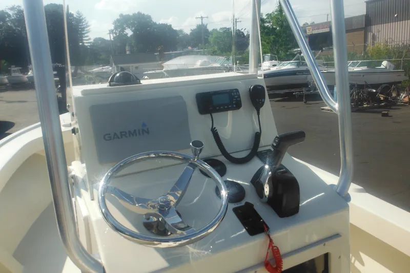 Slide: The Image of 2001 Parker 1801 Center Console boat with Garmin navigation system and steering wheel. - 25