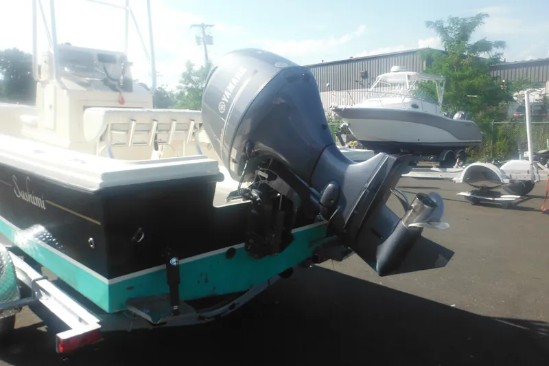 Slide: The Image of 2001 Parker 1801 Center Console boat with Yamaha outboard motor on trailer. - 3