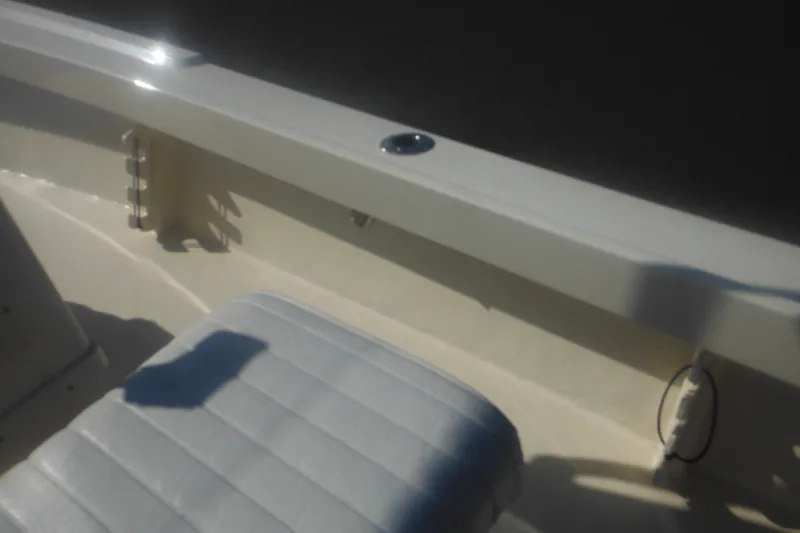 Slide: The Image of 2001 Parker 1801 Center Console boat interior with cushioned seating and side rail. - 43