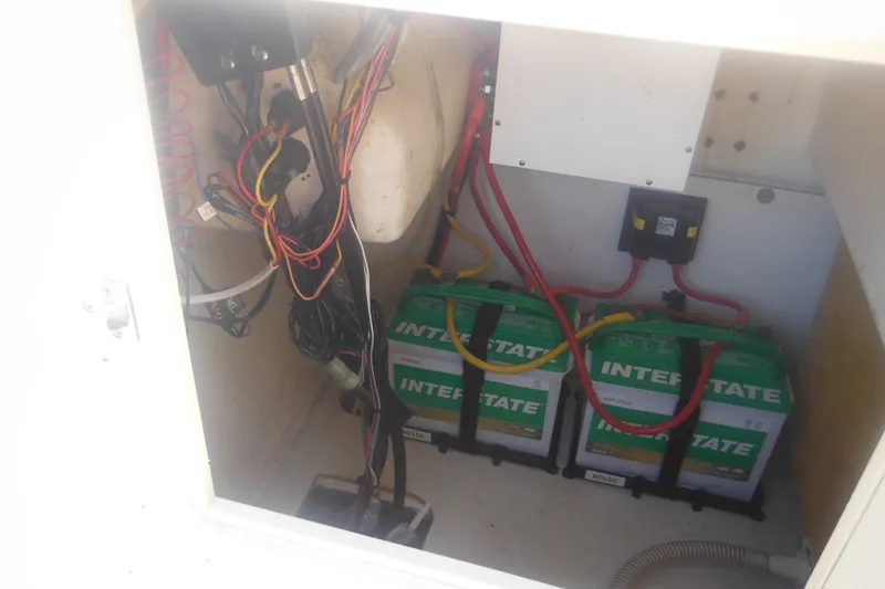 Slide: The Image of Battery compartment of a 2001 Parker 1801 Center Console boat with wiring and Interstate batteries. - 21