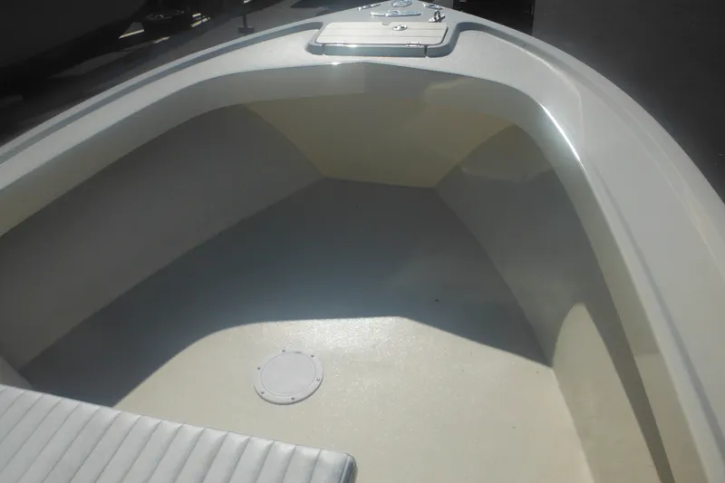 Slide: The Image of 2001 Parker 1801 Center Console boat interior, featuring spacious deck and storage hatch. - 19