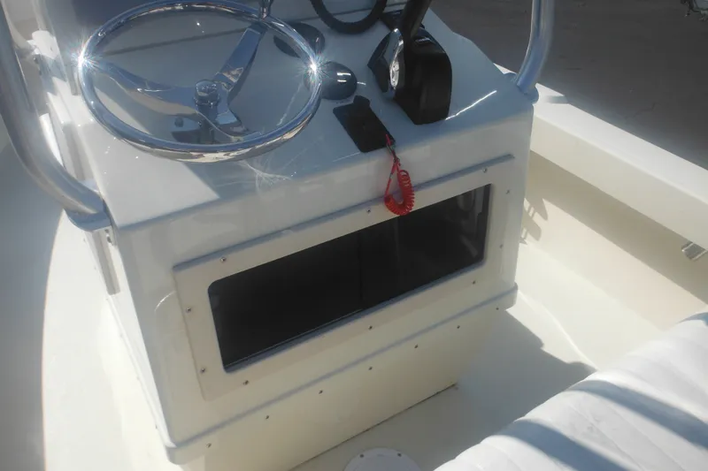 Slide: The Image of 2001 Parker 1801 Center Console boat interior with steering wheel and controls. - 24