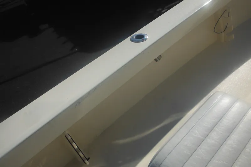 Slide: The Image of Interior view of a 2001 Parker 1801 Center Console boat, featuring seating and deck details. - 42