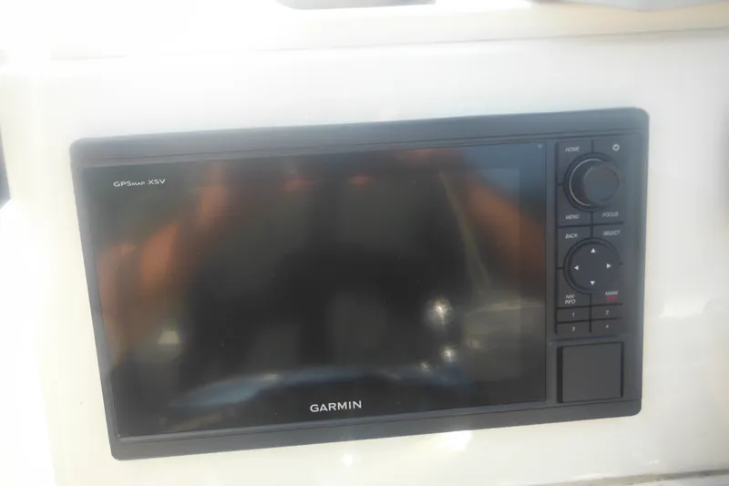 Slide: The Image of Garmin GPSMAP XSV on 2001 Parker 1801 Center Console boat dashboard. - 33
