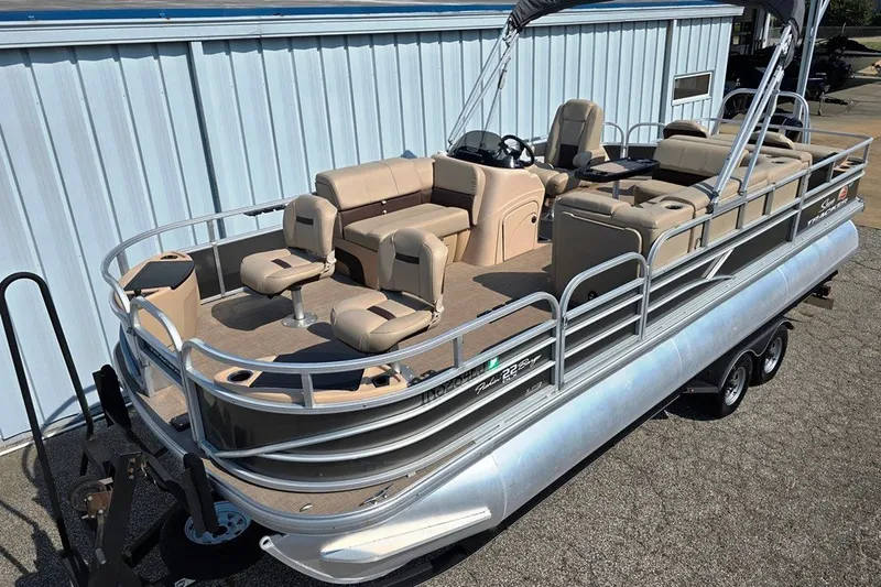 The Image of 2019 Sun Tracker Fishin' Barge 22 XP3 pontoon boat with beige seating and canopy. - 0