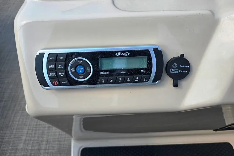 Slide: The Image of Jensen audio system on 2019 Sun Tracker Fishin' Barge 22 XP3 with USB input. - 16