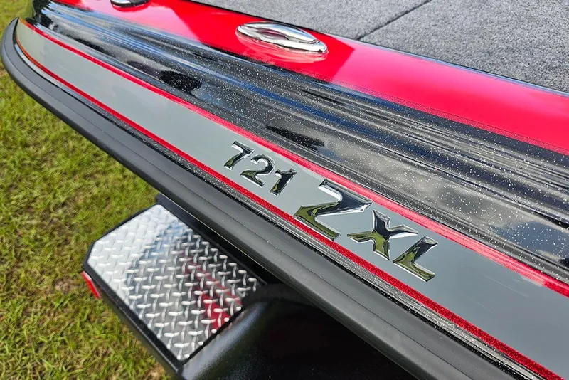 Slide: The Image of Close-up of 2027 Phoenix 721 ZXL boat with red and black detailing. - 21
