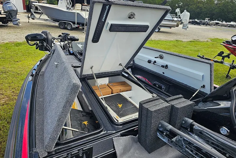 Slide: The Image of Open storage compartments on a 2027 Phoenix 721 ZXL boat, showcasing organized interior space. - 16