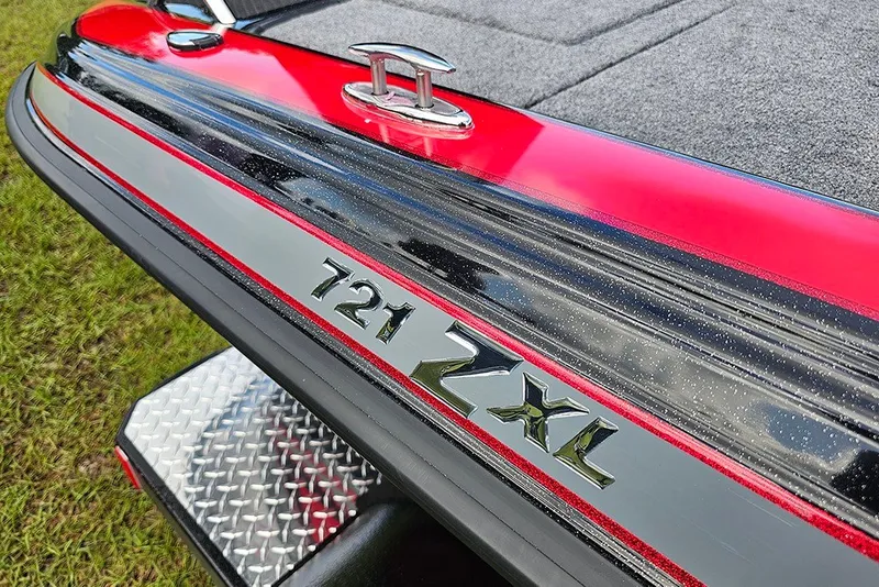Slide: The Image of Close-up of 2027 Phoenix 721 ZXL boat detailing with red and black accents. - 22