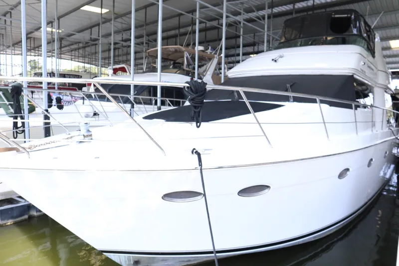 Slide: The Image of 1999 Carver Yacht Voyager 530 docked in a covered marina. - 8