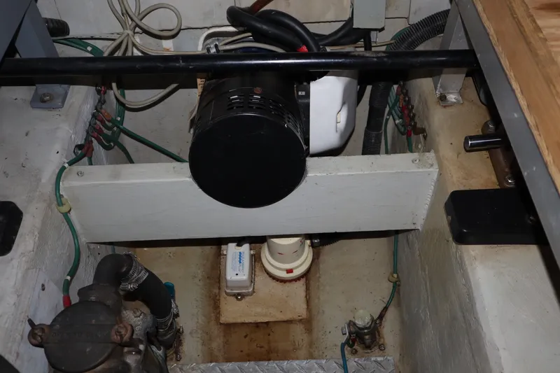 Slide: The Image of Engine compartment of a 1999 Carver Yacht Voyager 530, showcasing mechanical components. - 41