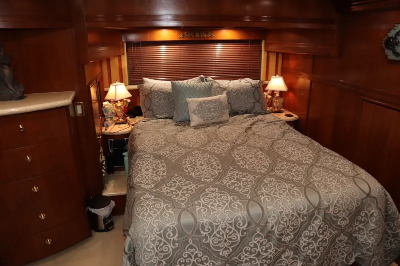 Slide: The Image of Luxurious bedroom interior of 1999 Carver Yacht Voyager 530 with elegant bedding and warm lighting. - 19