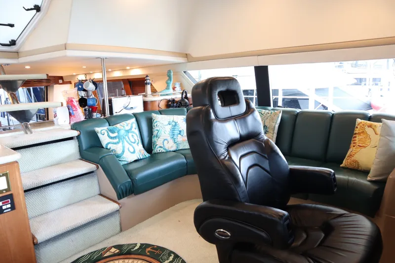Slide: The Image of Luxurious interior of 1999 Carver Yacht Voyager 530 with leather seating and nautical decor. - 25