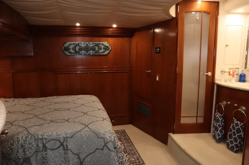 Slide: The Image of Luxurious interior of a 1999 Carver Yacht Voyager 530 with elegant wood finishes. - 20