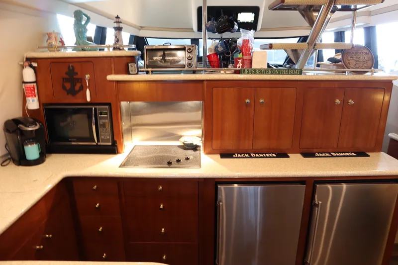 Slide: The Image of Luxurious kitchen interior of a 1999 Carver Yacht Voyager 530 with modern appliances. - 10