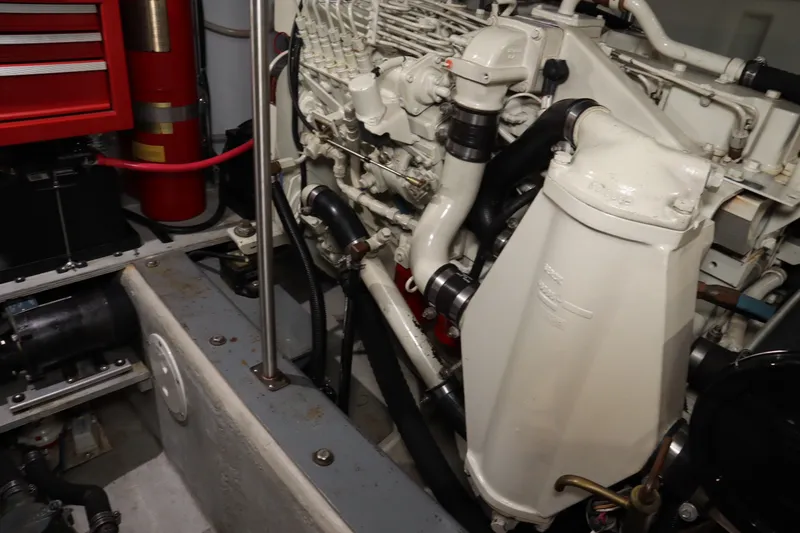 Slide: The Image of Engine room of a 1999 Carver Yacht Voyager 530, showcasing mechanical components and equipment. - 27