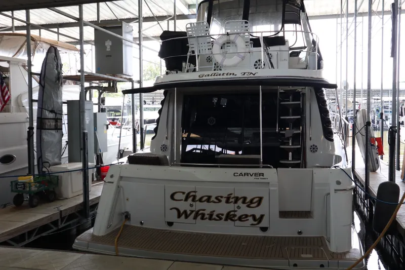 Slide: The Image of 1999 Carver Yacht Voyager 530 named "Chasing Whiskey" docked in Gallatin, TN marina. - 9