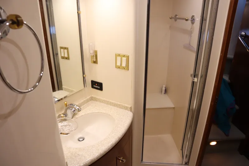 Slide: The Image of Bathroom interior of 1999 Carver Yacht Voyager 530 with sink and shower. - 36