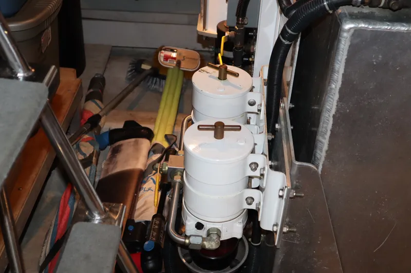 Slide: The Image of Engine room of 1999 Carver Yacht Voyager 530 with fuel filters and equipment. - 46