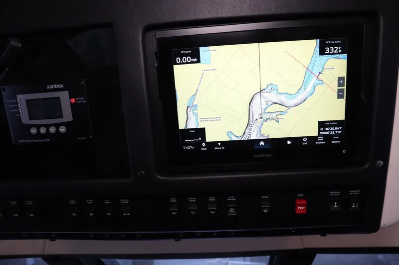 Slide: The Image of Control panel of a 1999 Carver Yacht Voyager 530 with GPS navigation display. - 24