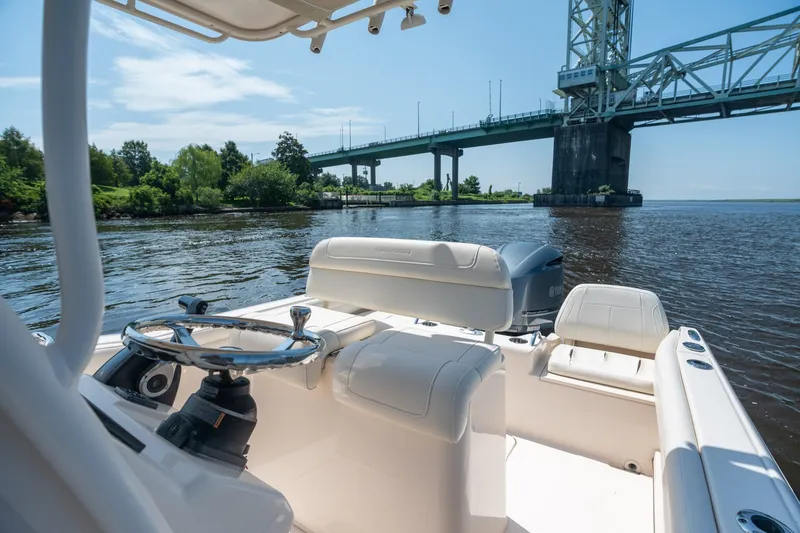 Slide: The Image of 2018 Grady-White Fisherman 216 boat on water near a bridge, sunny day. - 22