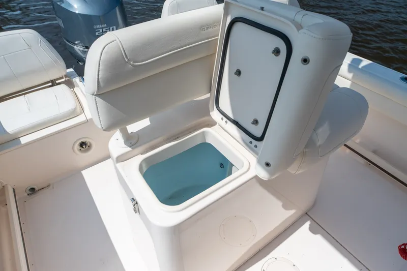 Slide: The Image of 2018 Grady-White Fisherman 216 boat with open storage compartment and Yamaha 250 engine. - 23