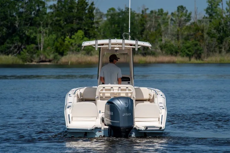 Slide: The Image of 2018 Grady-White Fisherman 216 boat cruising on a calm lake. - 7