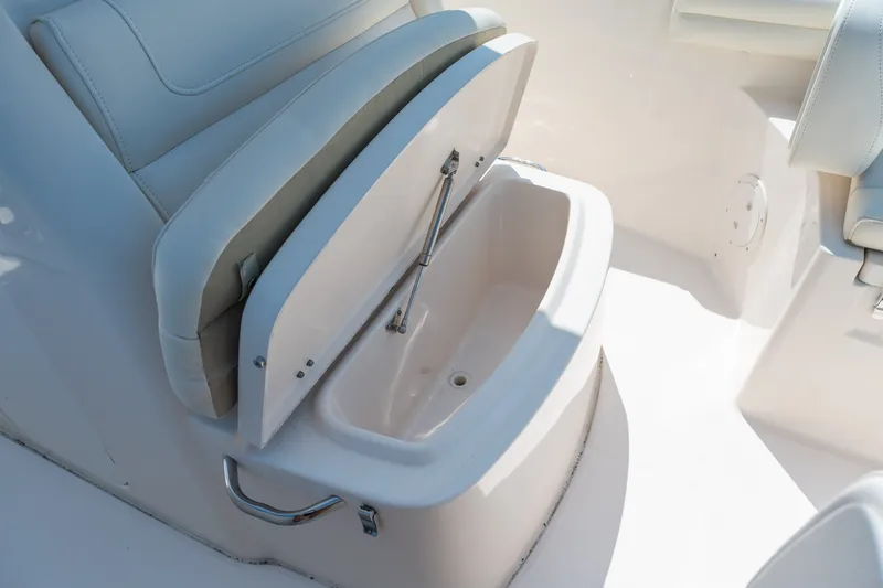 Slide: The Image of 2018 Grady-White Fisherman 216 boat seat with storage compartment open. - 29