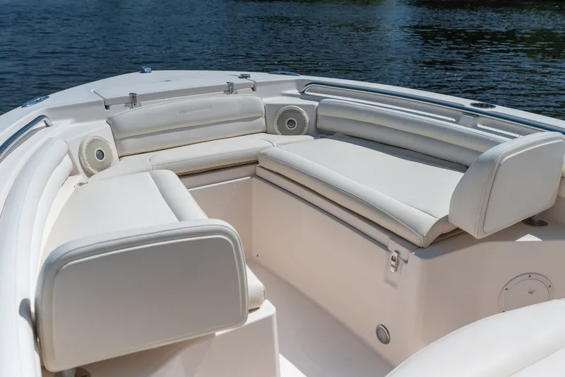 Slide: The Image of 2018 Grady-White Fisherman 216 boat interior with cushioned seating and speakers. - 26