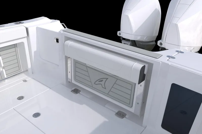 Slide: The Image of 2026 Blackfin 302 CC boat deck with dual outboard engines and storage compartment. - 13