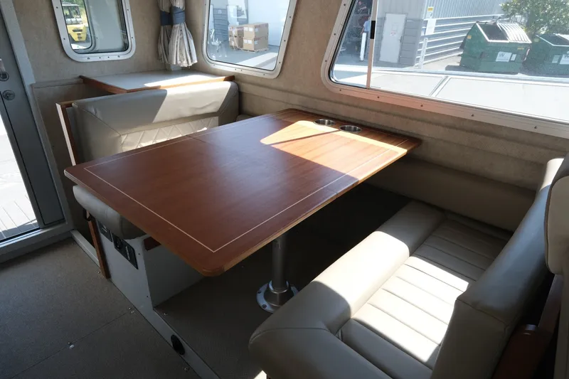 Slide: The Image of Interior of 2022 KingFisher 3425 GFX Offshore boat with dining table and seating. - 15