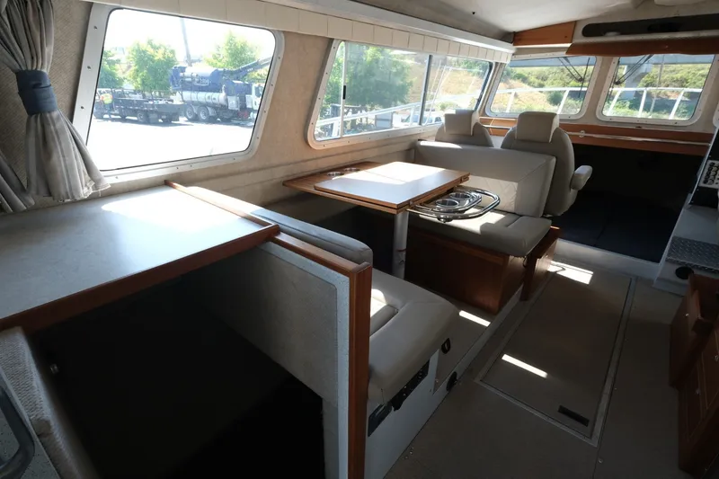 Slide: The Image of Interior of 2022 KingFisher 3425 GFX Offshore boat with seating and dining area. - 9