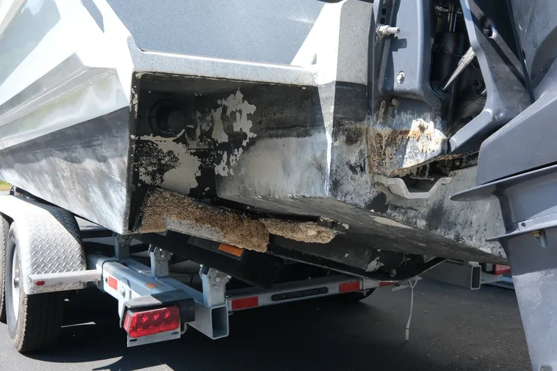 Slide: The Image of 2022 KingFisher 3425 GFX Offshore boat hull with barnacle growth on trailer. - 22