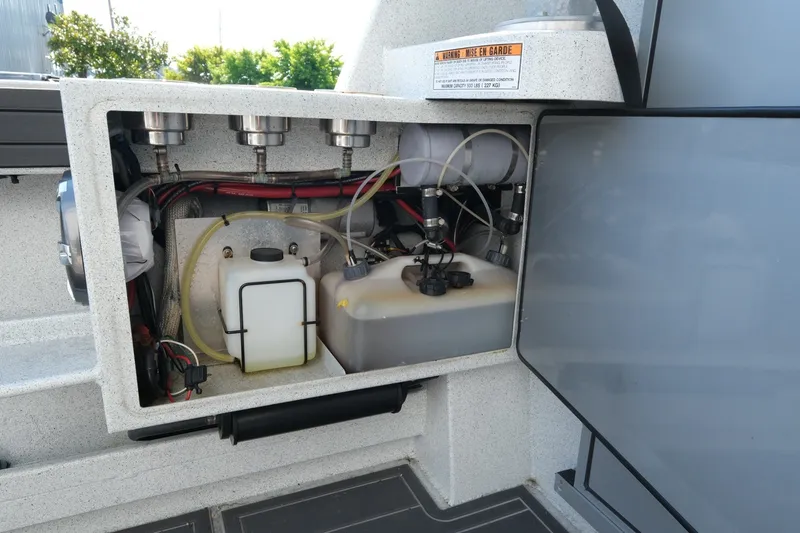 Slide: The Image of Open compartment of 2022 KingFisher 3425 GFX Offshore boat showing internal components and wiring. - 23